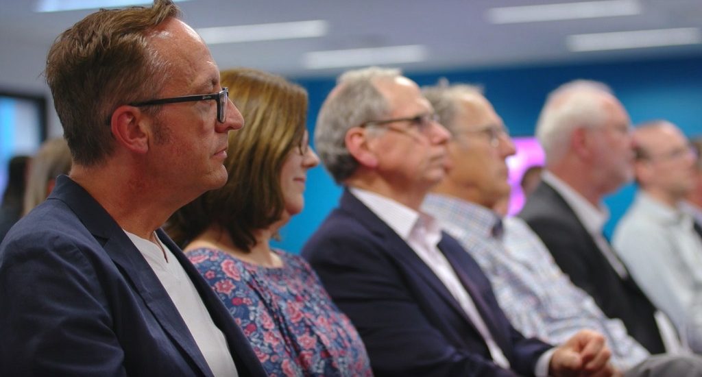 Investors in a crowd