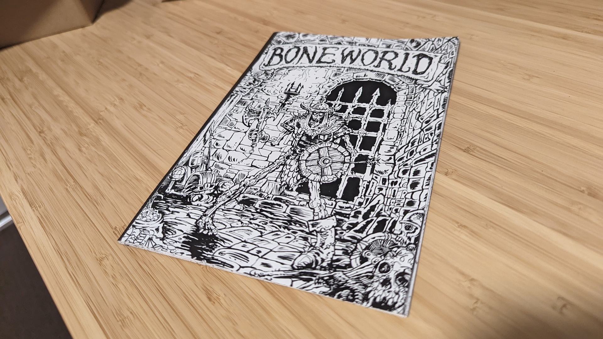 Boneworld magazine on table